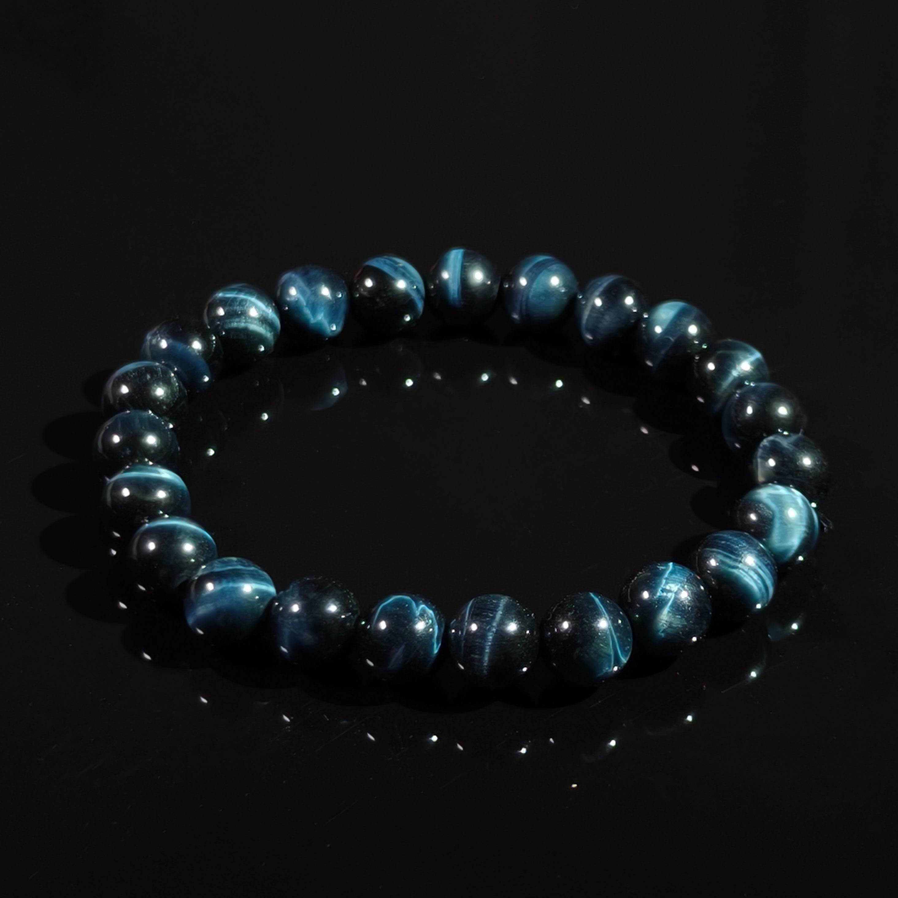 Blue Tiger’s Eye bead bracelet with polished round stones and natural cat’s eye sheen.