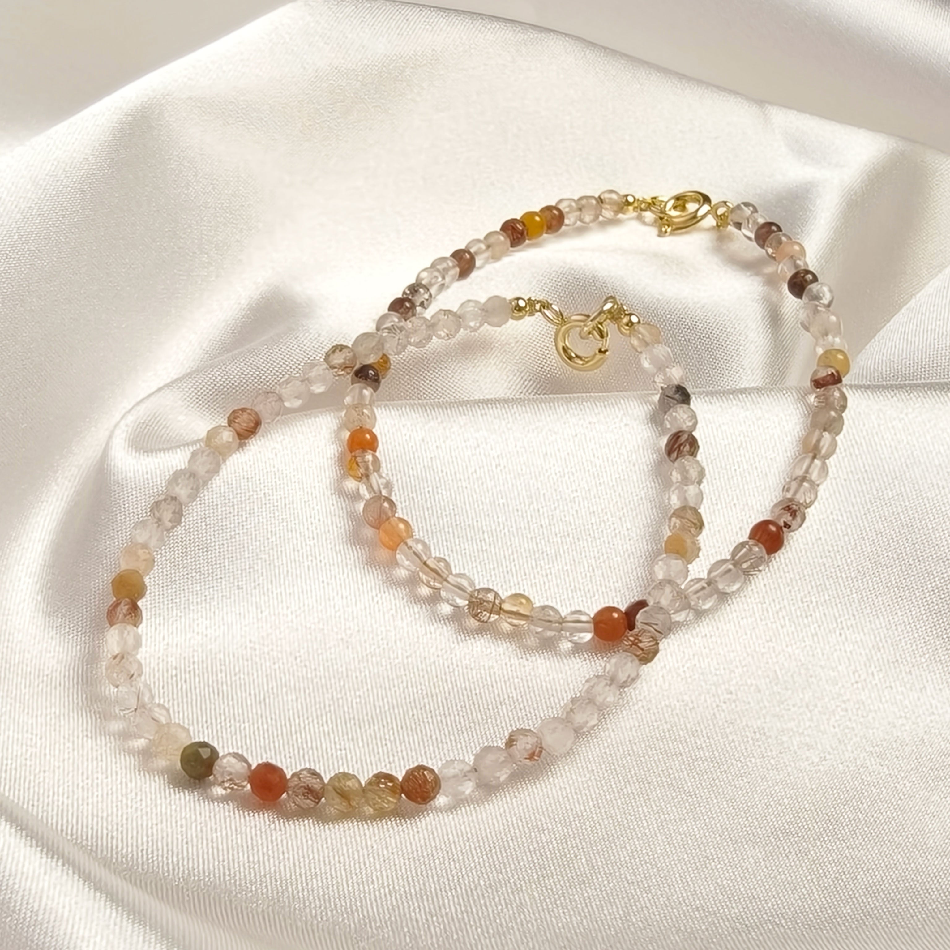 Etheris Natural Copper Rutilated Quartz Bracelet - Dainty Faceted Crystal Beads with Gold Clasp, attracting wealth and good fortune, boosting positive energy.