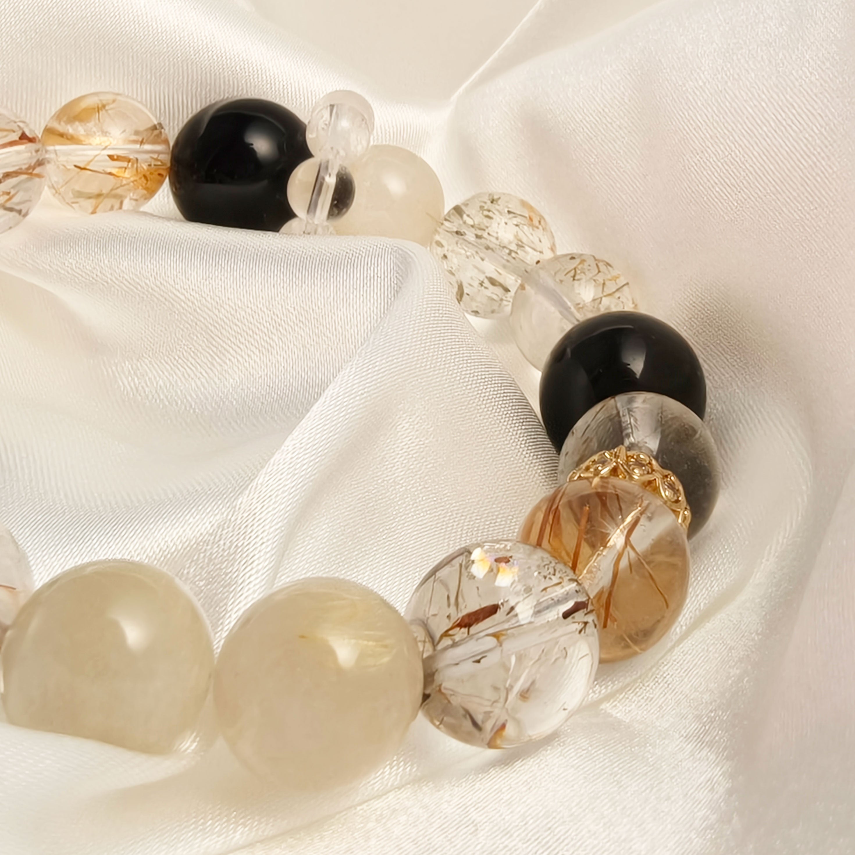 Etheris Genuine Super Seven Crystal Bracelet - A powerful blend of seven minerals, promoting deep healing, effective stress relief, and acting as a strong spiritual protector while inviting financial prosperity.