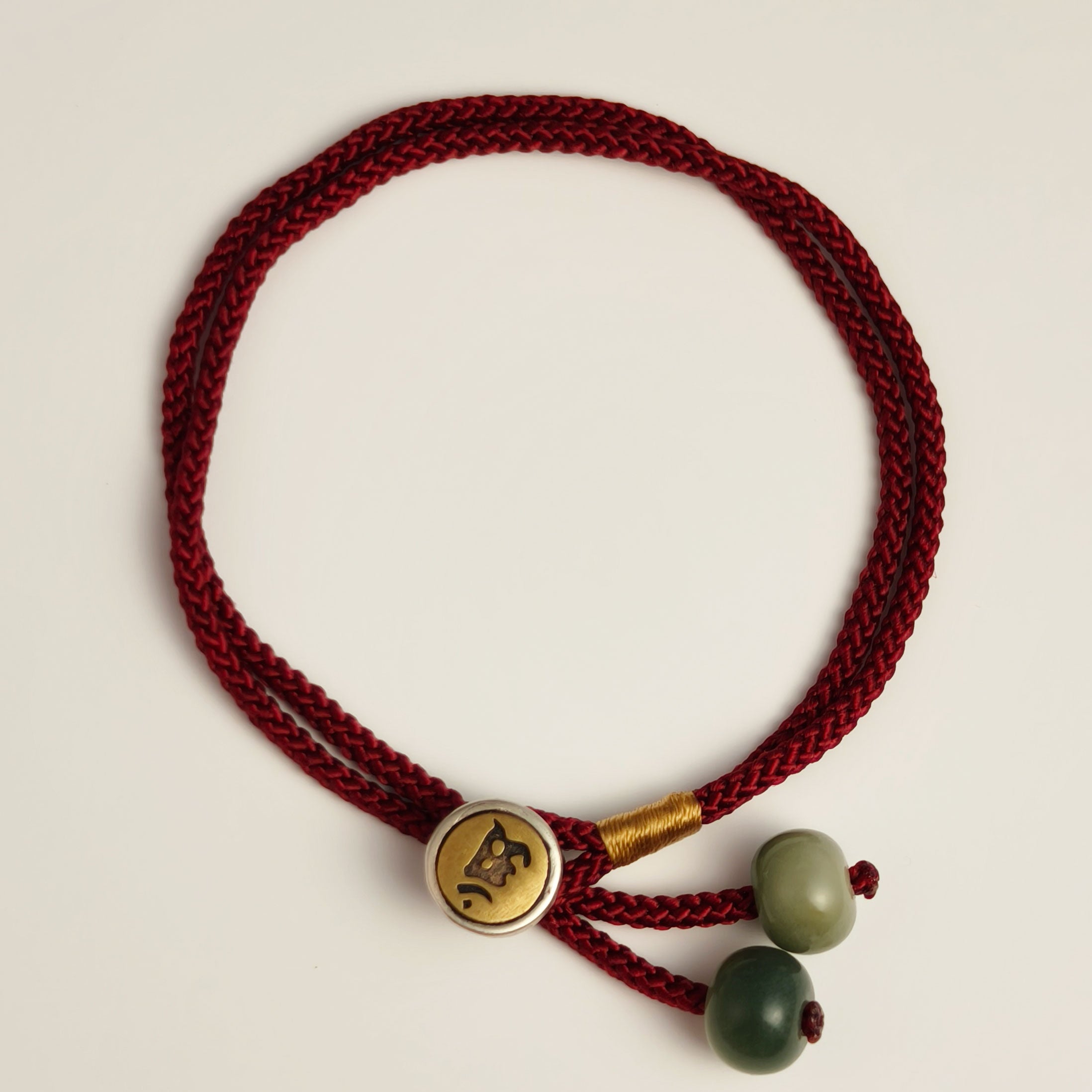 Red string bracelet with bodhi seed beads and engraved clasp for protection