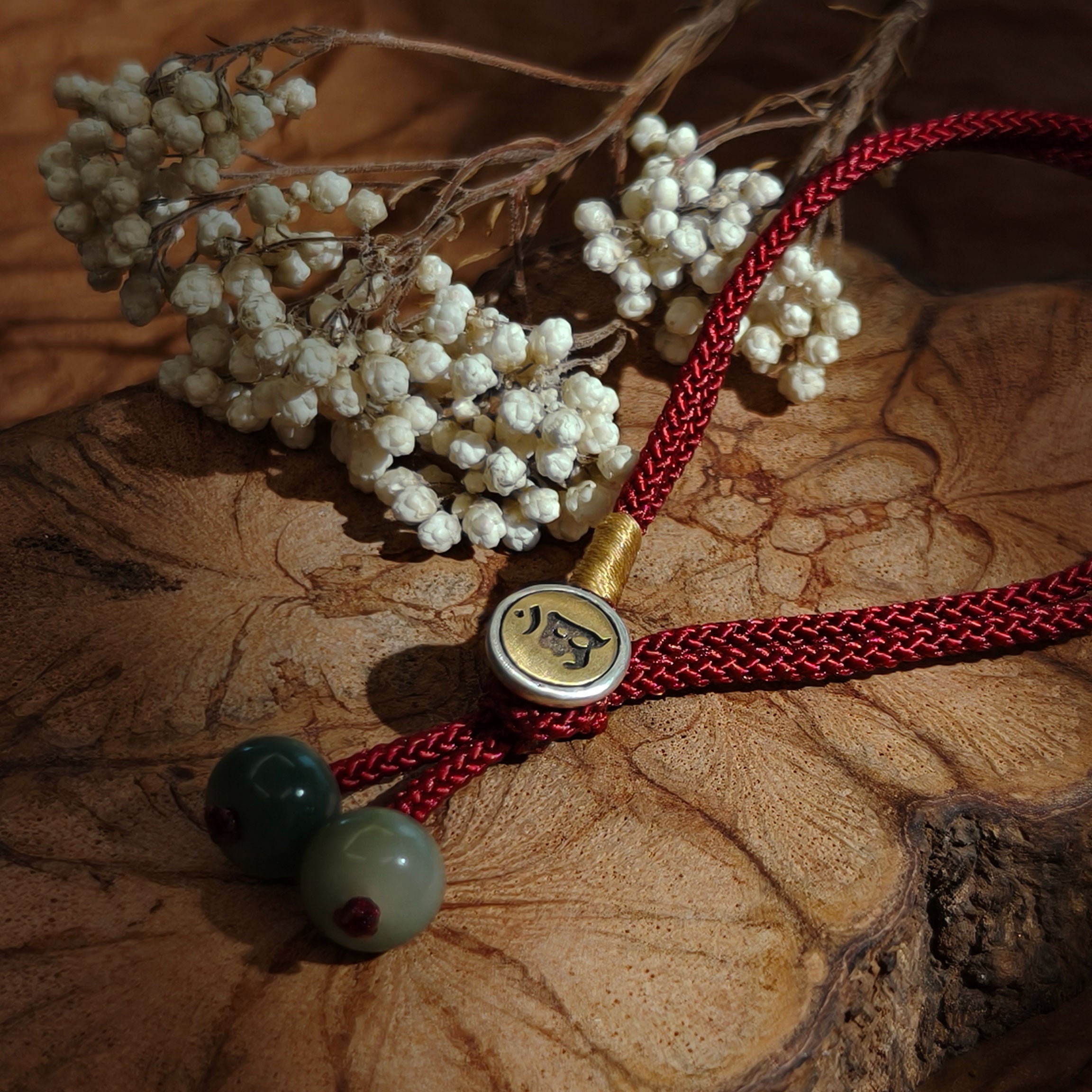 Red string bracelet with bodhi seed beads and engraved clasp for protection