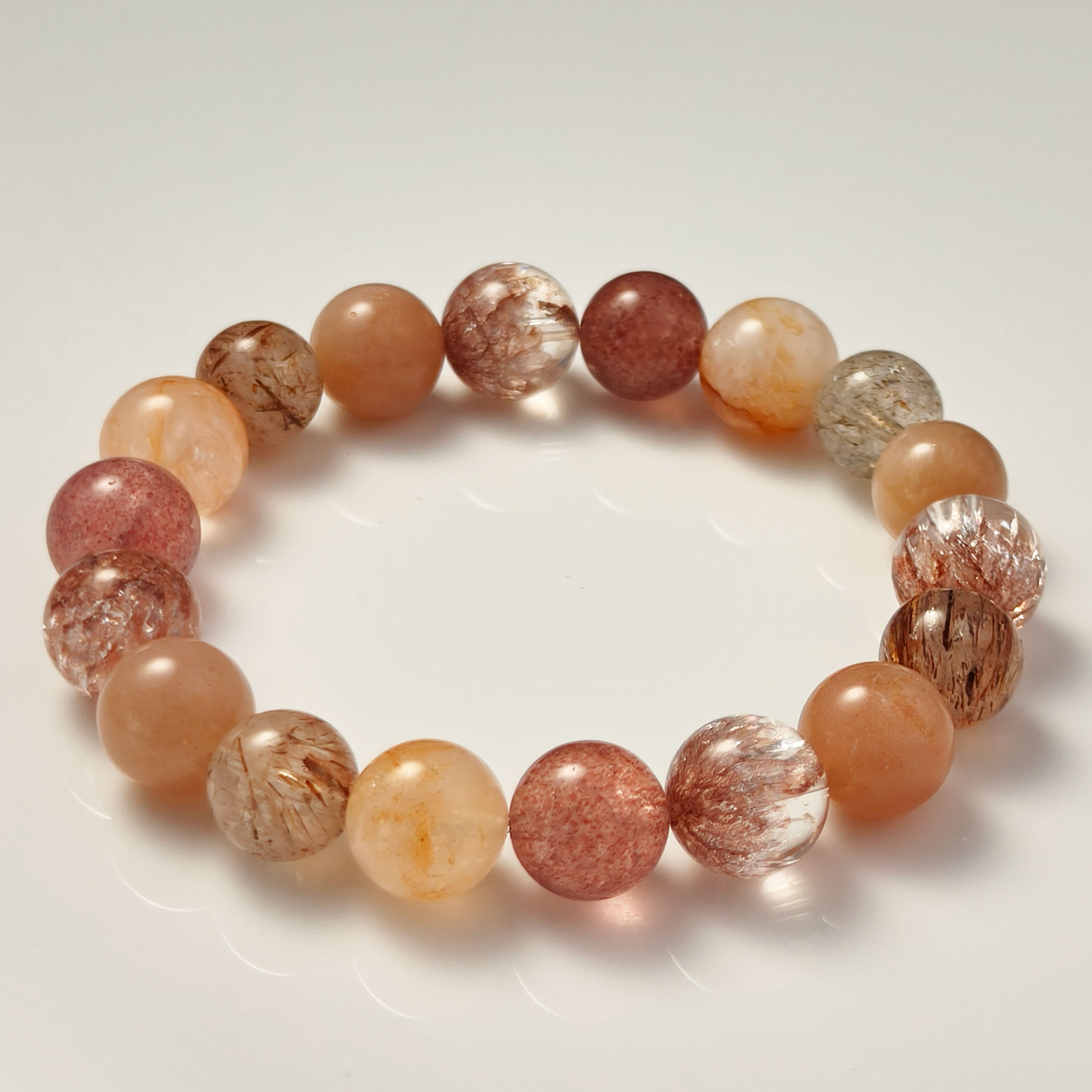 Etheris Natural Hematoid Quartz Bracelet - Vibrant Fire Quartz crystal jewelry, offering healing properties for stress relief, improving sleep quality, and nurturing love and connection.